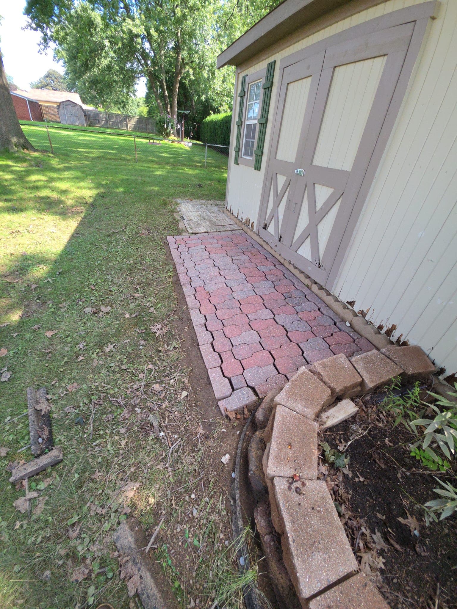 After rear building pavers. oil stain treatment in Canton, OH - SurfaceWorks ProWash